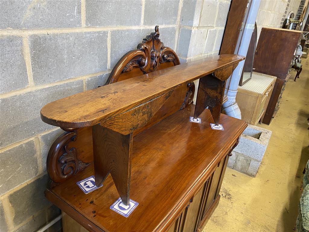 An 18th century elm bench seat, length 183cm, height 49cm